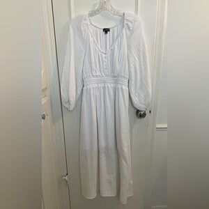 Beautiful, white, Easter dress. Nice sleeves keep chills away. Fully lined.